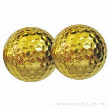 Gold color golf balls, used in tournaments